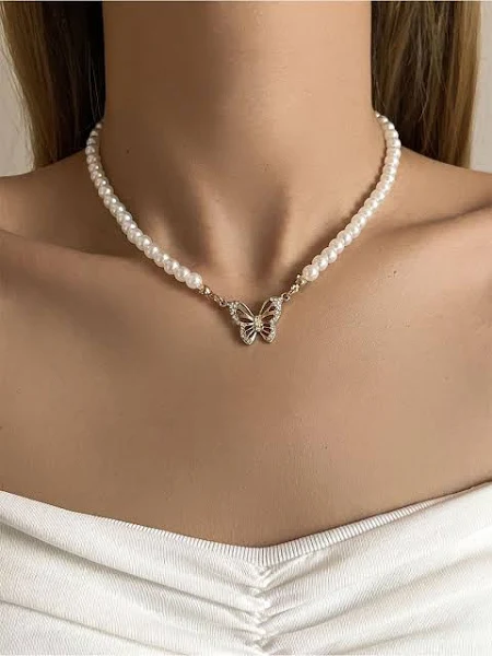 a woman wearing a bead necklace